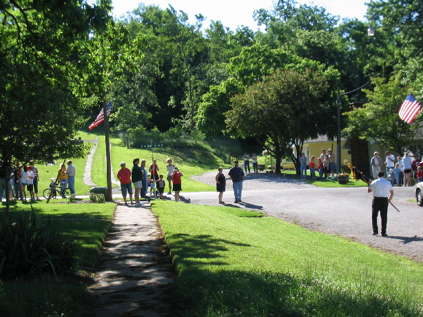 Village residents and visitors gather for the morning ceremonies on Memorial Day 2004