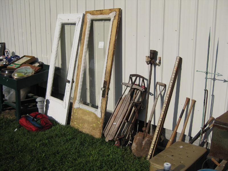 Doors with character (from an Arenzville house), an old sled and some tools are among the things for sale at Haney's.