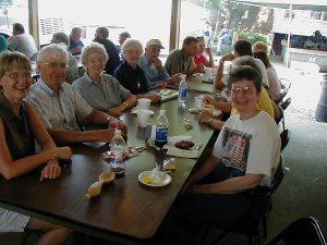 Mike and Donna Wheelan (second and third on the left) traveled from Washington, IA, for their first visit to the Arenzville Burgoo and a reunion with Mike's sister, Roberta Clark and her family. Diana Boll, from Kinmundy, IL (on the right) also joined in.