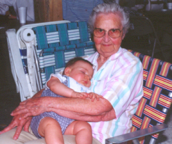 Vera Talkemeyer cuddles a sleeping grandchild