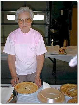 Vera Talkemeyer prepares to slice into a blueberry pie.