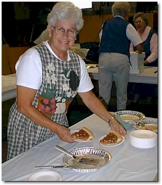 Shirley Wessler dishes up two scrumptious pieces of pecan pie.