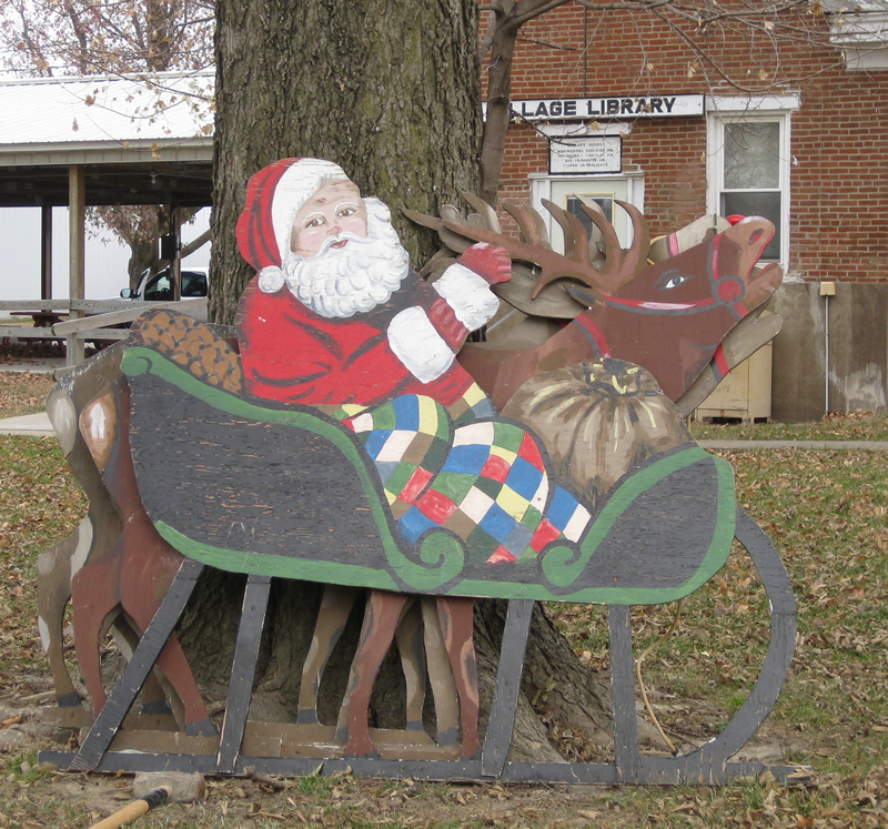 Santa, his sleigh, and reindeer, ready to be placed in the Village Park.