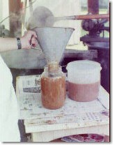 Filling a gallon jug with burgoo