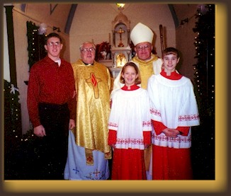 St. Fidelis Eucharist Minister Lucas Jockisch, Father Eugene Weitzel, Bishop Daniel L. Ryan, and Servers Jodi Schone and Kayla Kinsey.