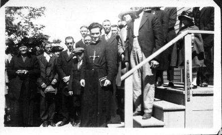 Unidentified priest and congregation members on the steps of St. Fidelis. Photo taken around 1920 (?).