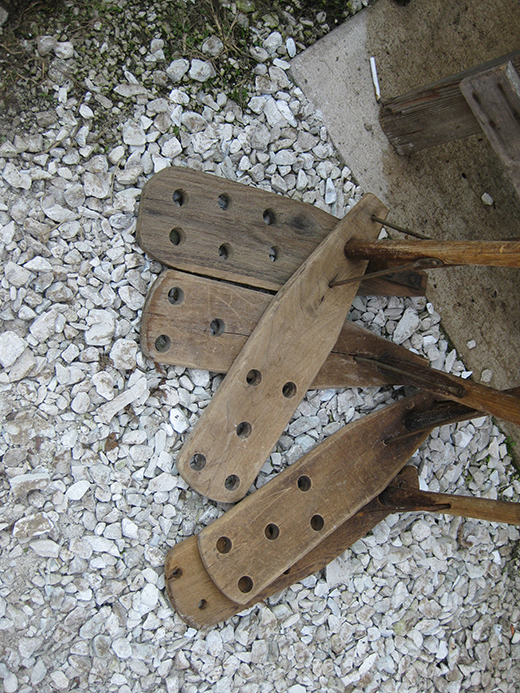 group of wooden paddles